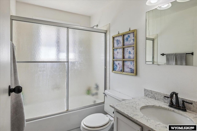 147 Apache Dr, Evanston, WY 82930 - full bath with toilet, vanity, and bath / shower combo with glass door