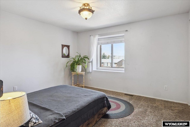 147 Apache Dr, Evanston, WY 82930 - bedroom with carpet floors and baseboards