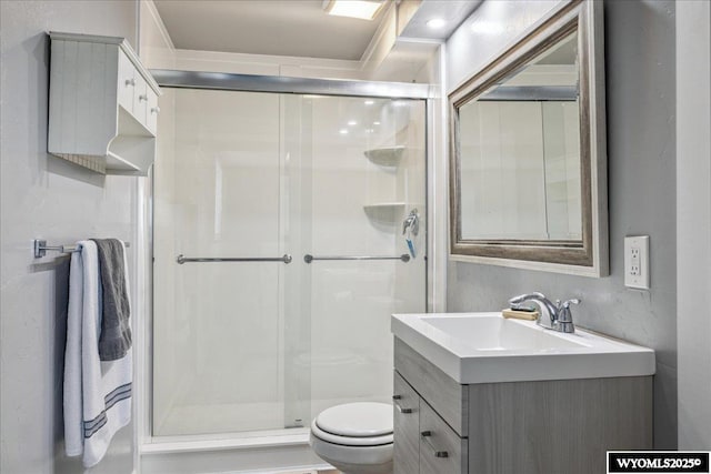 147 Apache Dr, Evanston, WY 82930 - full bathroom featuring toilet, a stall shower, and vanity