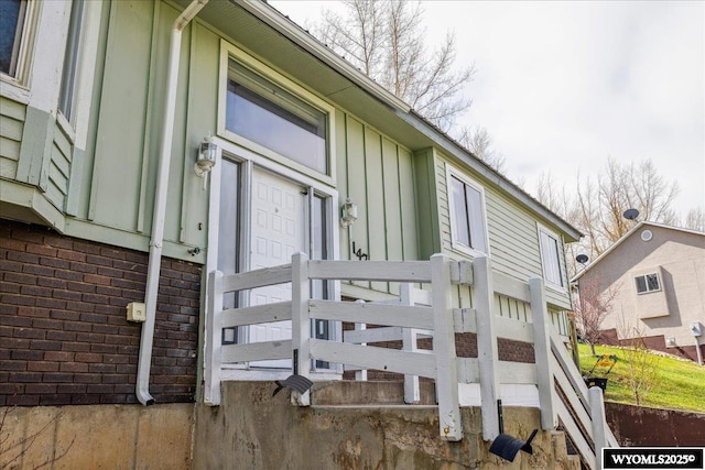 147 Apache Dr, Evanston, WY 82930 - view of side of property featuring board and batten siding and brick siding