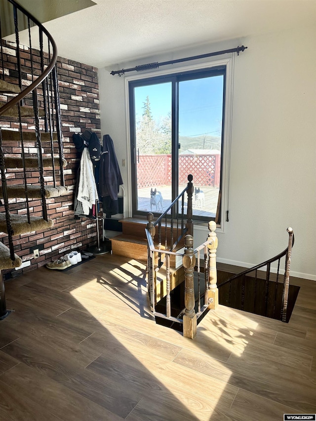 618 Emerald St, Kemmerer, WY 83101 - dining area featuring wood finished floors, baseboards, and stairs