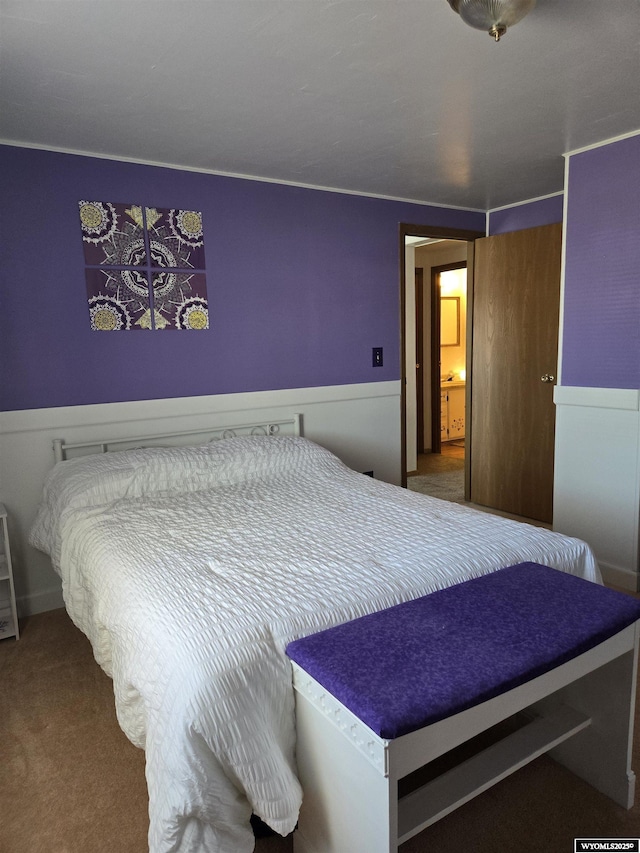 716 E 3rd St, Marbleton, WY 83113 - carpeted bedroom featuring wainscoting