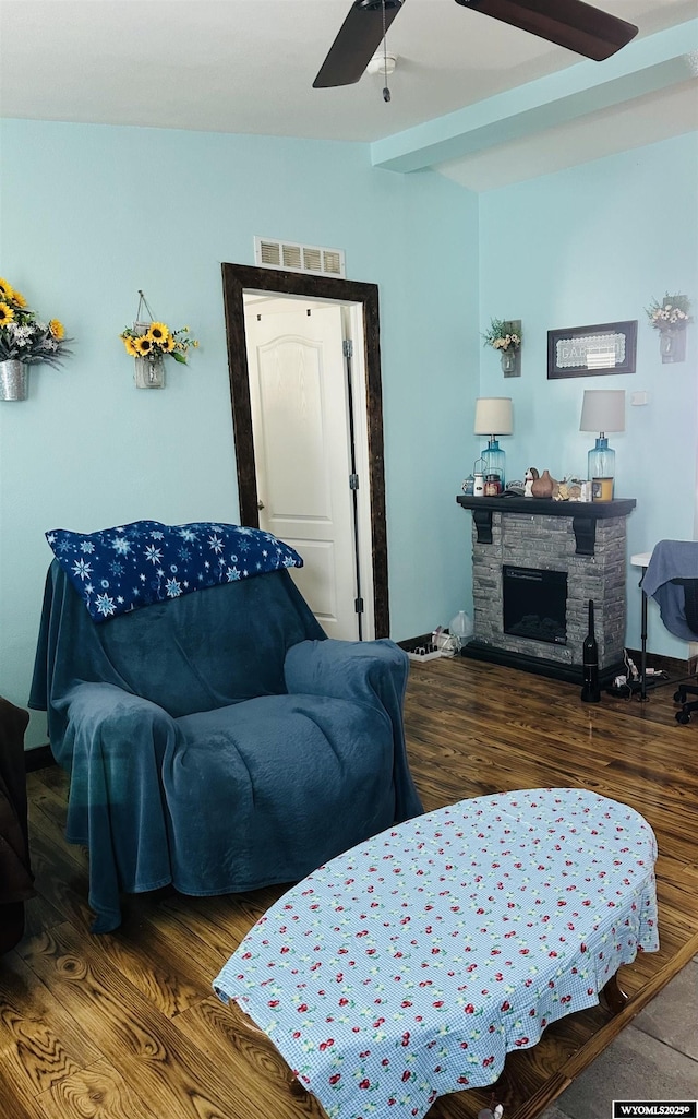 65 Eagle Ln, Lyman, WY 82937 - living area with a ceiling fan, wood finished floors, and a stone fireplace