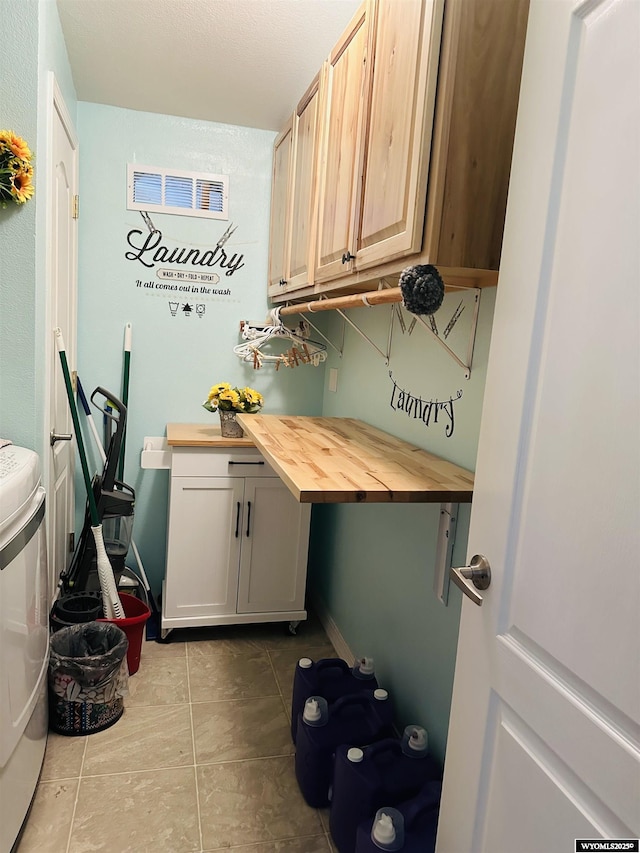65 Eagle Ln, Lyman, WY 82937 - washroom with cabinet space and tile patterned floors
