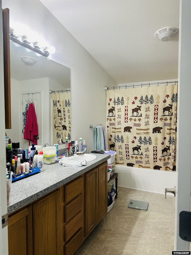 65 Eagle Ln, Lyman, WY 82937 - bathroom featuring vanity, tile patterned flooring, and shower / bathtub combination with curtain
