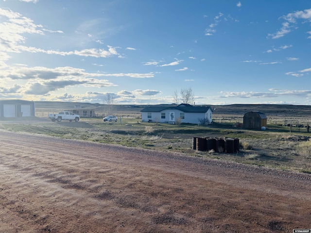 65 Eagle Ln, Lyman, WY 82937 - view of yard with an outbuilding, a garage, a rural view, and dirt driveway