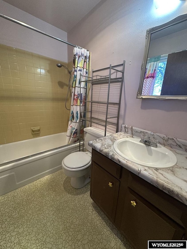 full bath with tile patterned floors, shower / bathtub combination with curtain, toilet, and vanity