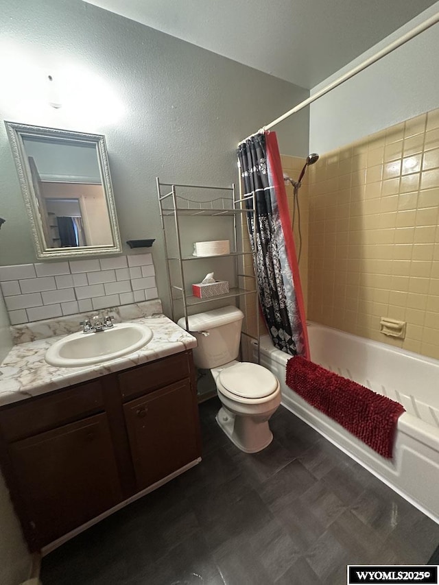 full bathroom featuring shower / bath combo, toilet, vanity, tile patterned floors, and tasteful backsplash