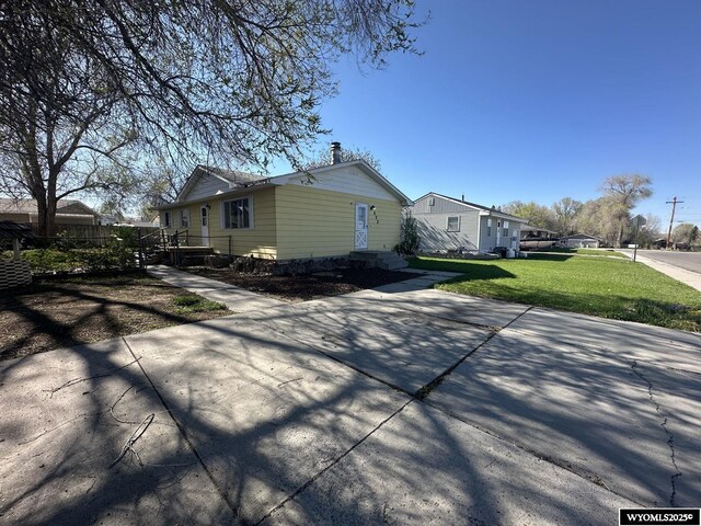 view of home's exterior featuring a lawn