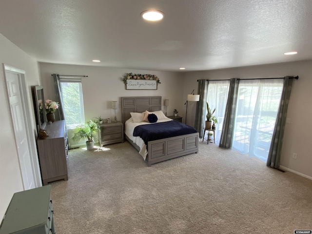 4230 S Oak St, Casper, WY 82601 - bedroom featuring carpet floors, a textured ceiling, recessed lighting, and access to outside