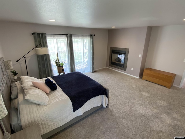4230 S Oak St, Casper, WY 82601 - carpeted bedroom with recessed lighting, baseboards, and a glass covered fireplace