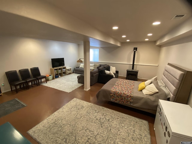 4230 S Oak St, Casper, WY 82601 - bedroom with recessed lighting and a wood stove