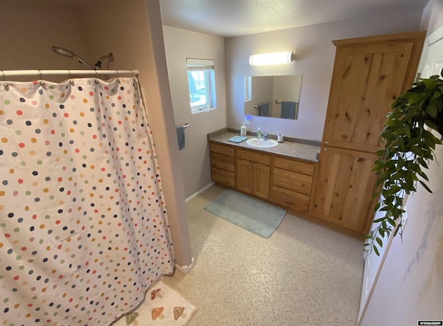 4230 S Oak St, Casper, WY 82601 - full bathroom featuring vanity, curtained shower, and baseboards