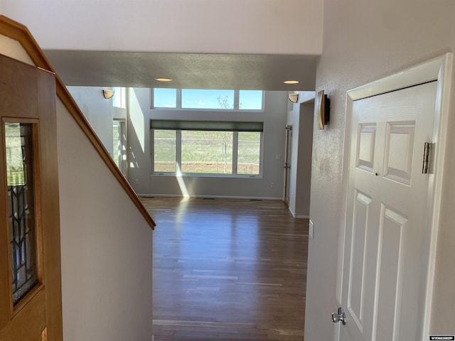 4230 S Oak St, Casper, WY 82601 - entryway featuring wood finished floors, baseboards, stairs, and a textured wall