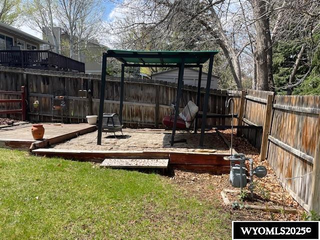 view of yard featuring a wooden deck