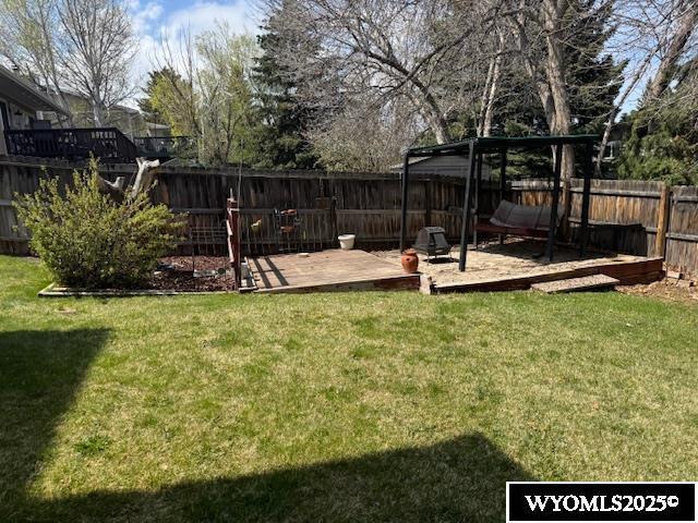 view of yard featuring a wooden deck