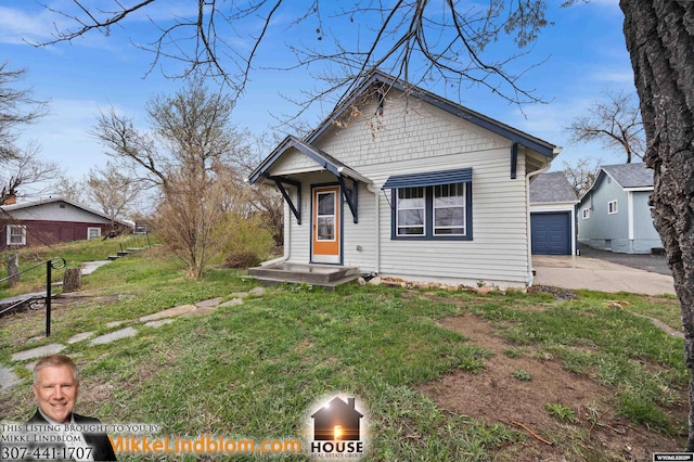 view of front of property with a front lawn and a garage