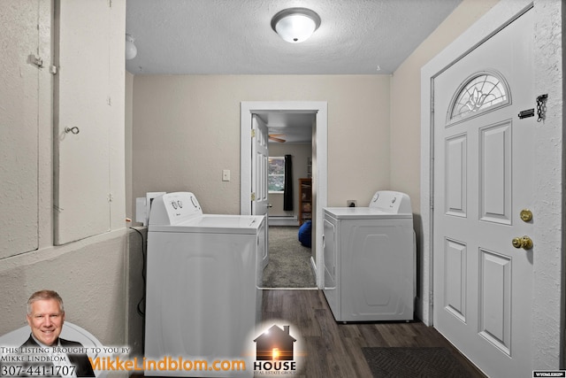 laundry area with washer and dryer, a textured ceiling, and dark wood-type flooring