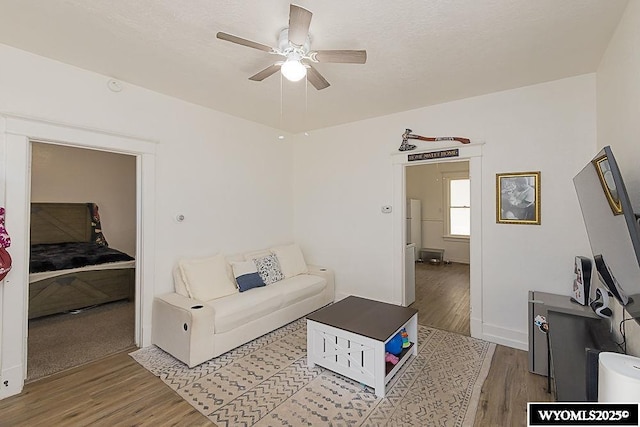 330 M St, Rock Springs, WY 82901 - living area featuring wood finished floors, ceiling fan, and baseboards