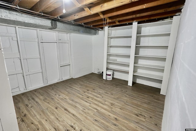 unfinished basement with wood finished floors