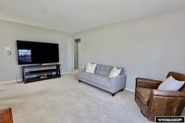 living room featuring carpet and baseboards