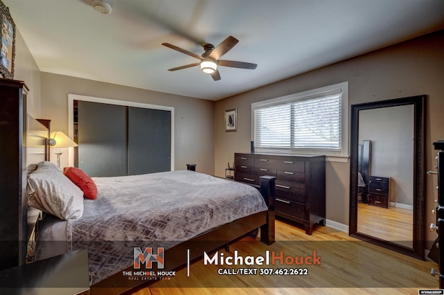 bedroom featuring light wood finished floors, a closet, baseboards, and a ceiling fan