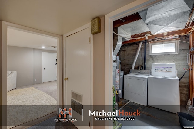 laundry area featuring washing machine and clothes dryer