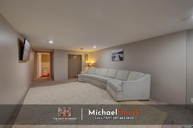 living area featuring carpet and recessed lighting
