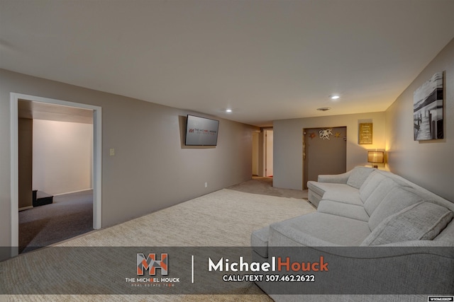 living room with recessed lighting and carpet floors