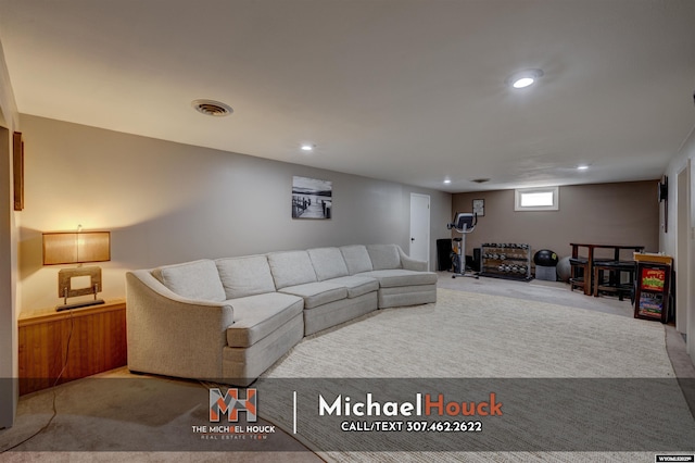 carpeted living area featuring recessed lighting