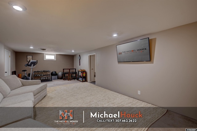 carpeted living room with recessed lighting