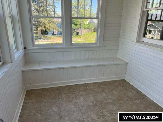 unfurnished room featuring plenty of natural light