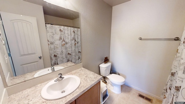 bathroom with toilet, vanity, baseboards, tile patterned floors, and a shower with shower curtain