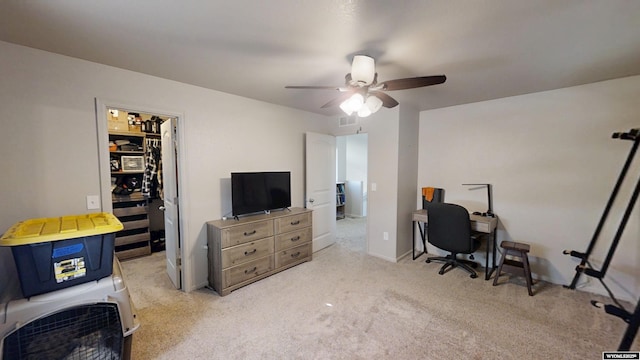 office area featuring a ceiling fan and carpet