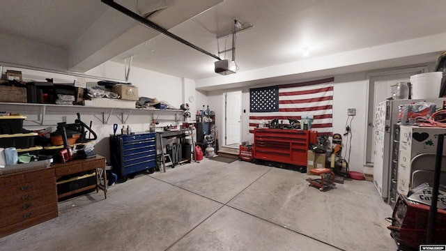 garage featuring a workshop area and a garage door opener