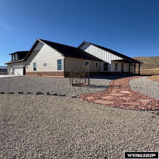 145 Cedar Lookout, Lander, WY 82520 - view of side of property with board and batten siding
