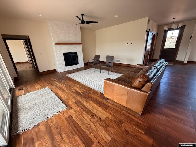 145 Cedar Lookout, Lander, WY 82520 - living area featuring a large fireplace, wood finished floors, baseboards, and recessed lighting