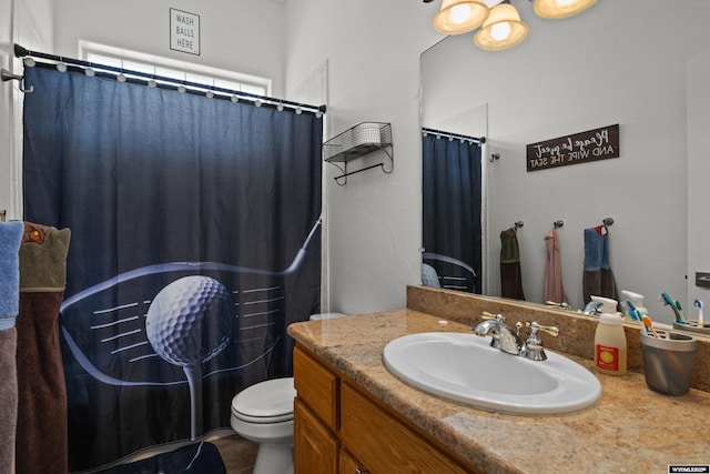 full bathroom with toilet, vanity, and curtained shower