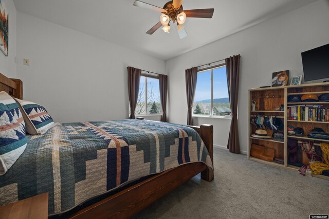 bedroom with carpet and a ceiling fan