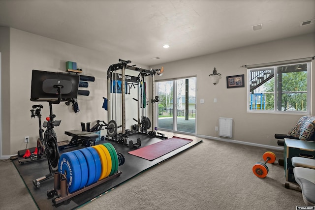 workout area with plenty of natural light and baseboards