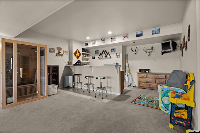 game room with a dry bar, carpet, recessed lighting, and baseboards