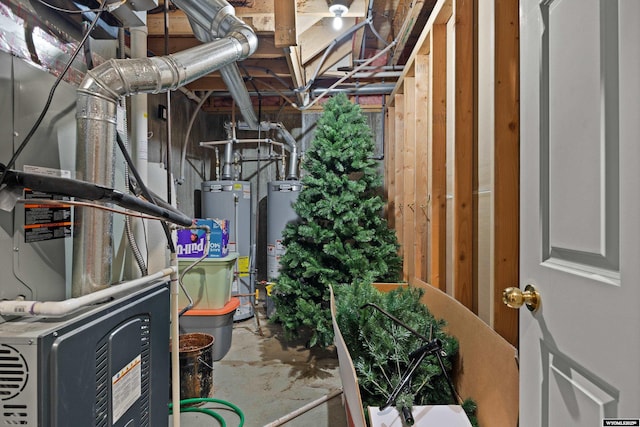 utility room featuring gas water heater and heating unit