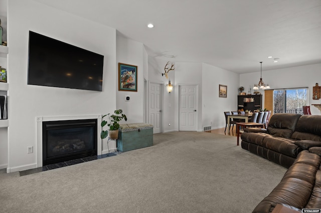 living area featuring carpet, a chandelier, recessed lighting, a fireplace with flush hearth, and baseboards
