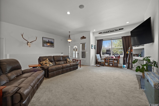 carpeted living area with recessed lighting