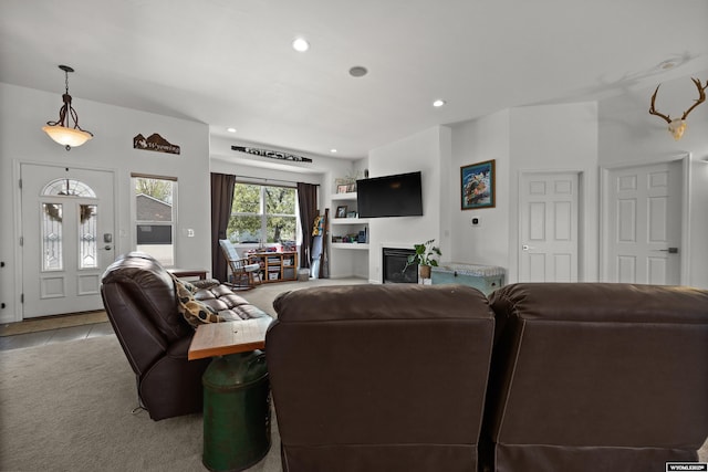 living area featuring recessed lighting and light tile patterned floors