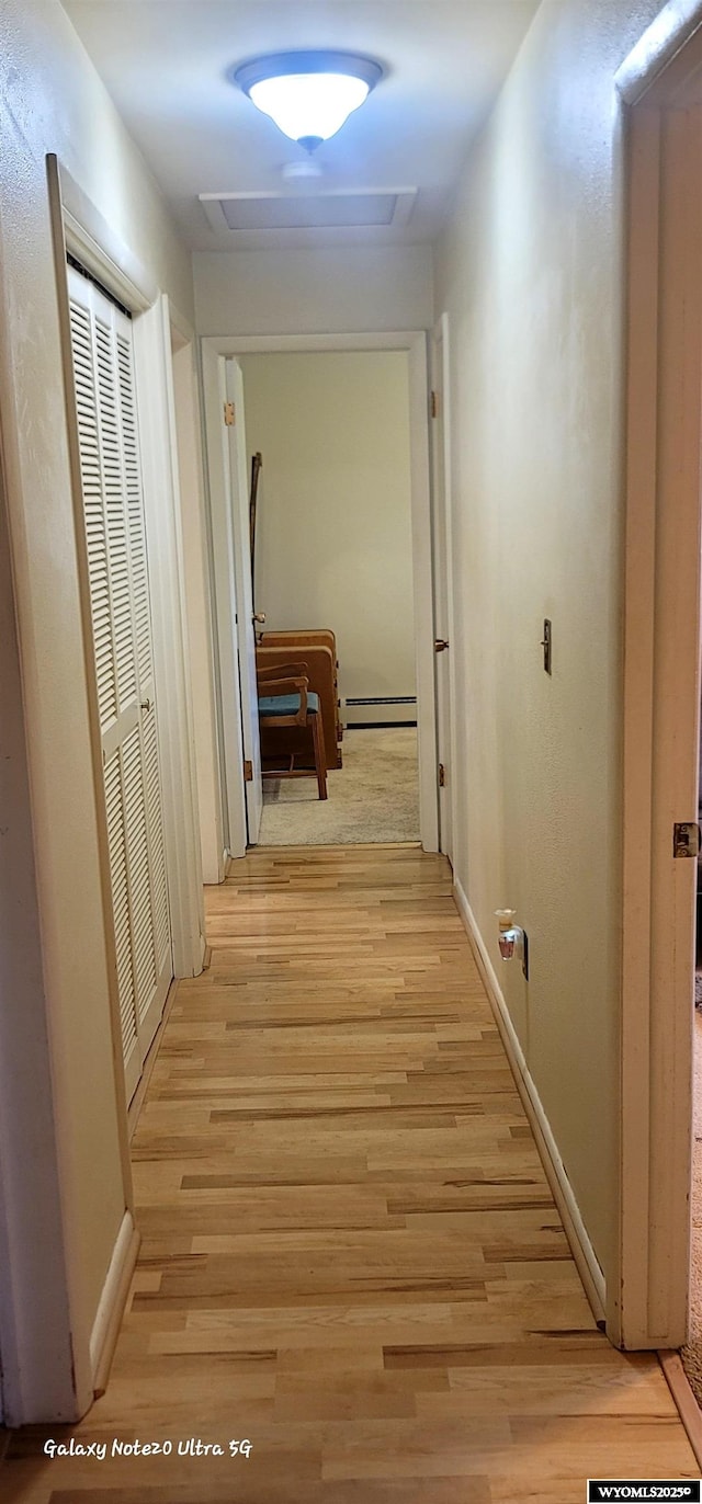 1630 De Smet Ave, Sheridan, WY 82801 - corridor with a baseboard radiator, light wood-style flooring, and baseboards