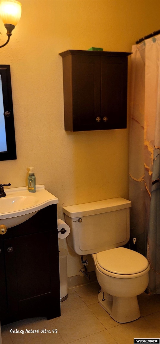 1630 De Smet Ave, Sheridan, WY 82801 - full bathroom featuring toilet, tile patterned flooring, and vanity