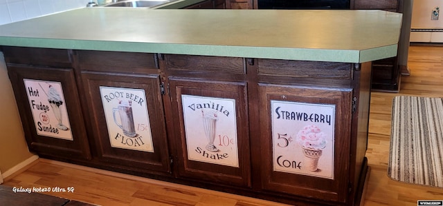 1630 De Smet Ave, Sheridan, WY 82801 - detailed view of wood finished floors, a sink, and baseboards