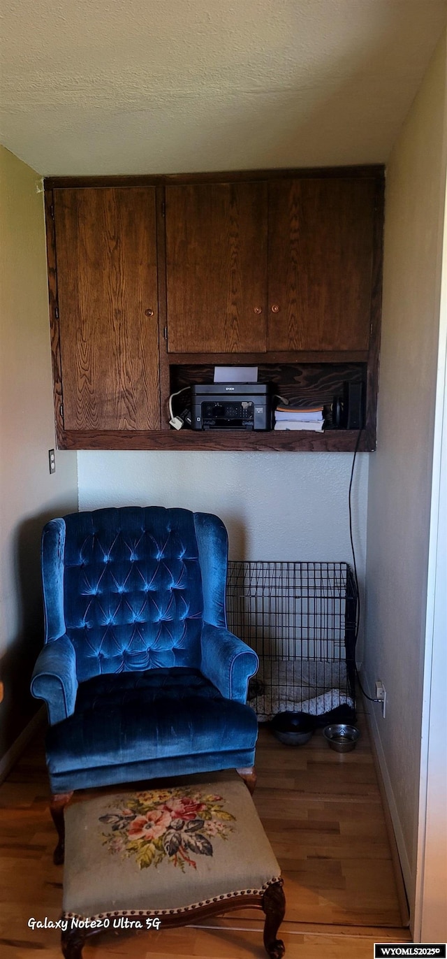 1630 De Smet Ave, Sheridan, WY 82801 - detailed view of baseboards, wood finished floors, and dark brown cabinetry