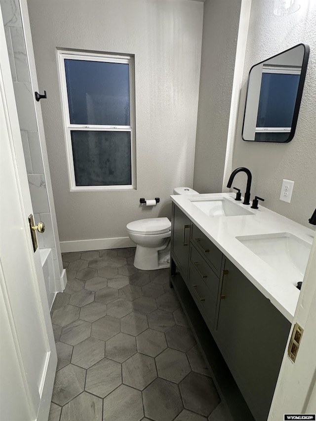 bathroom with toilet, double vanity, tile patterned flooring, a bathtub, and a shower